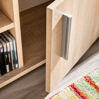 Détail de la porte en bois chêne sonoma avec poignée moderne sur le meuble TV Loftora