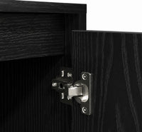 Gros plan sur la charnière métallique robuste d'une porte de meuble TV Loftora noir au veinage bois élégant